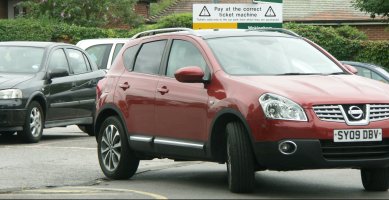 New sign obscured by a car